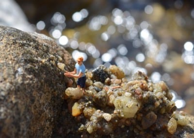 A tiny figure standing on a rock